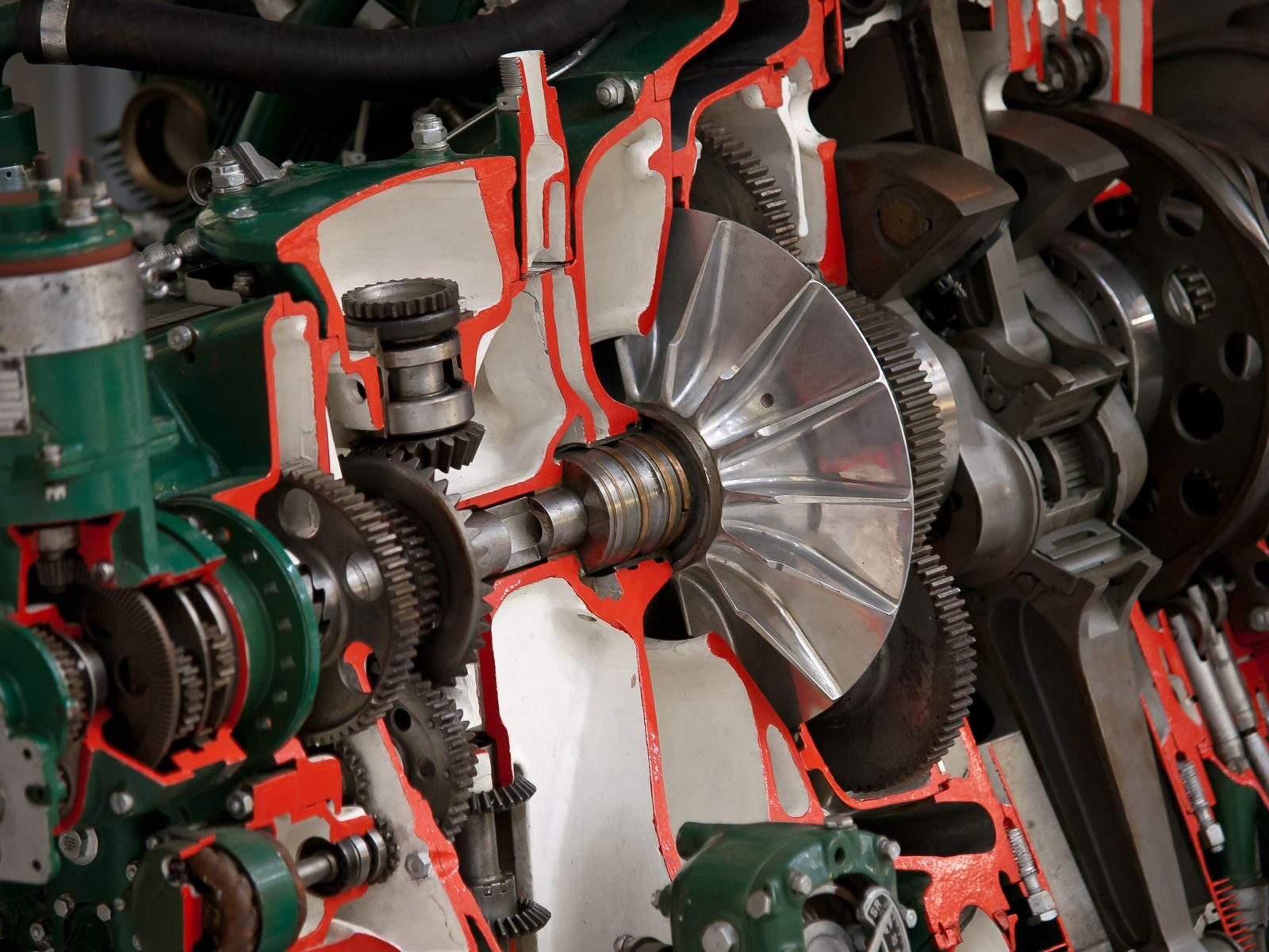 Detailed view of industrial machinery showcasing gears and cogs inside a mechanical system.